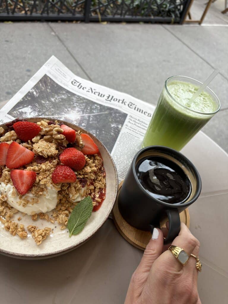 Yogurt and granola bowl with coffee and green juice at Nem´s Bistro, New York.