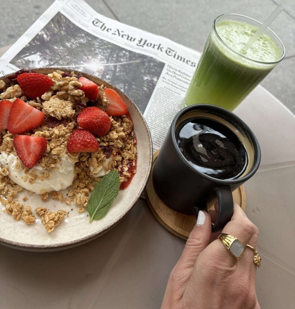 Yoghurt and granola bowl with coffee and green juice at Nem´s Bistro, New York.